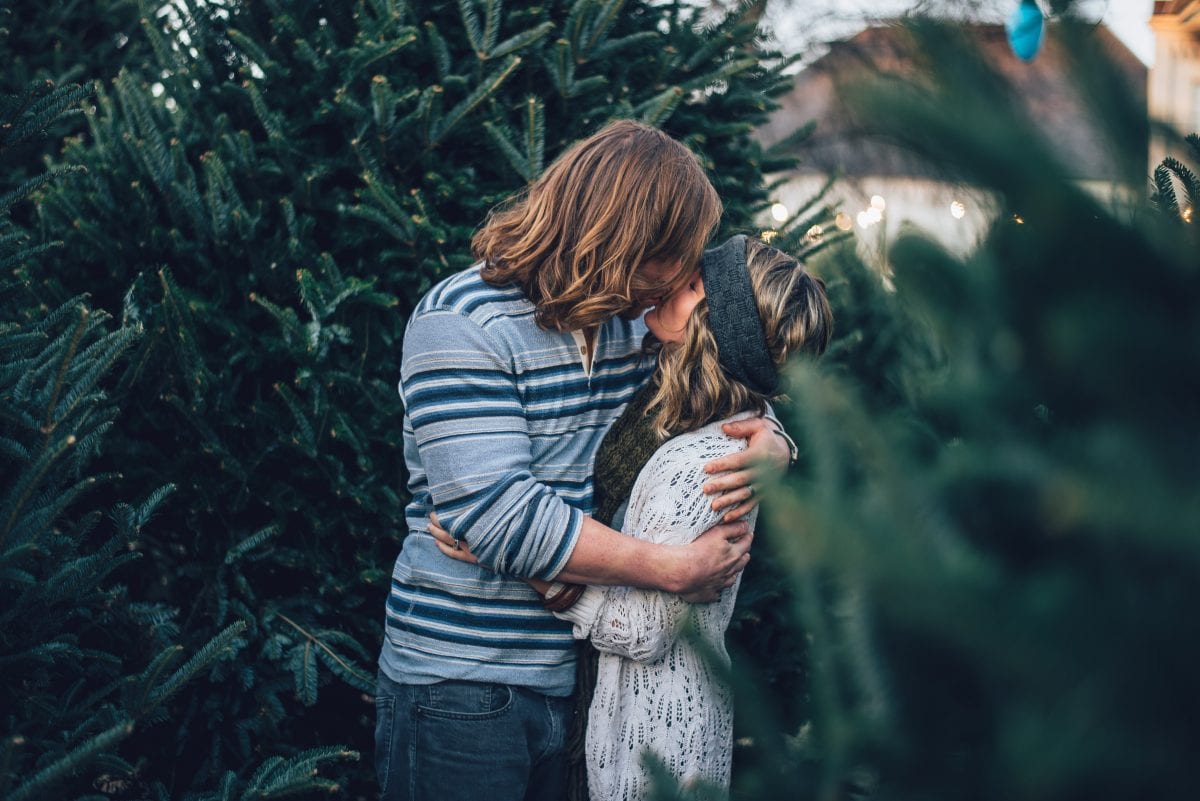 A guy kissing a girl to show how men fall in love