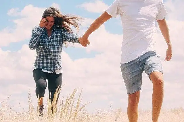 Couple playing in the field