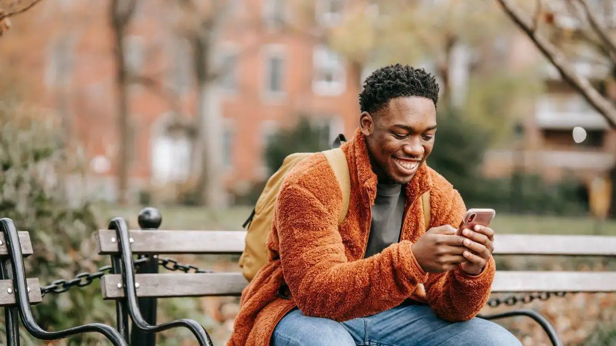 A guy chatting and smiling