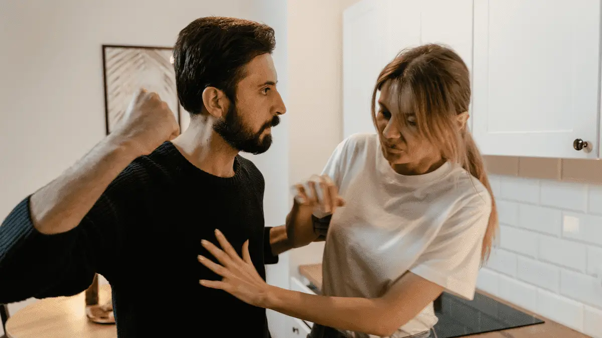 
A Man Showing Aggression to a Woman