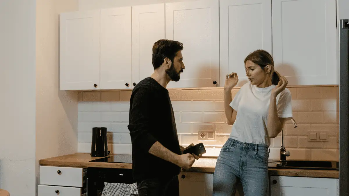 A man folding his hand to beat his wife