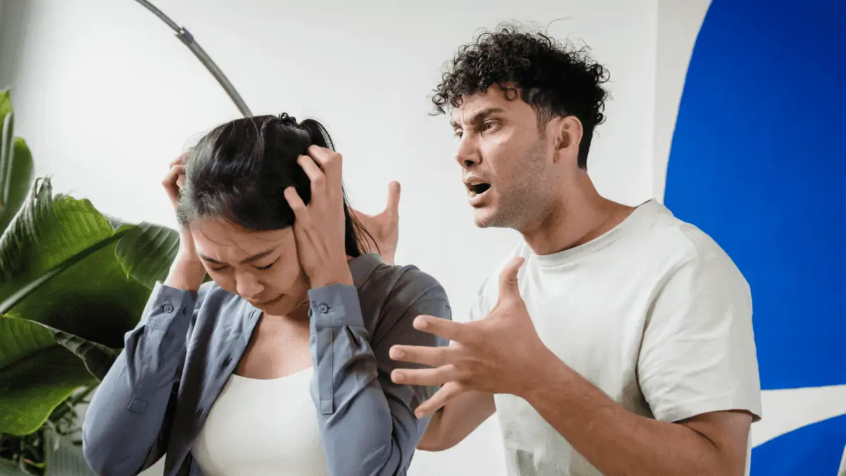 a man shouting at his wife