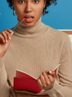 A lady writing down her goals