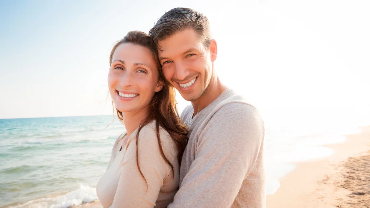 Narcissists husband hugging wife from behind