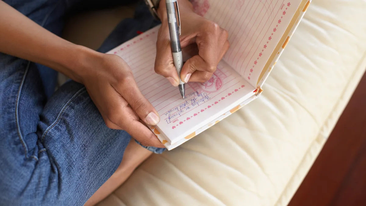 A woman journaling for relationship