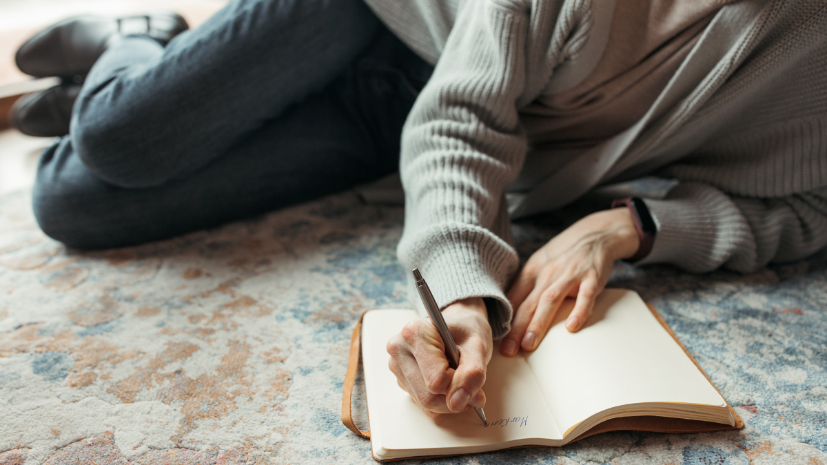 A woman writing a journal