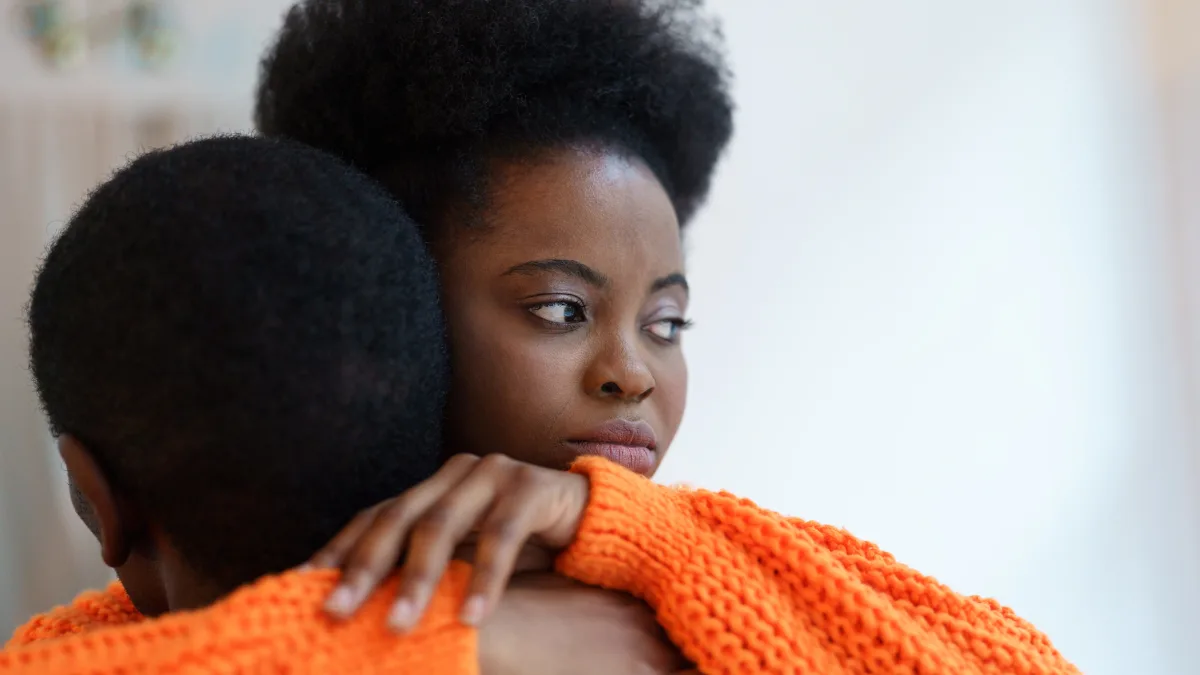 A guy and a girl hugging