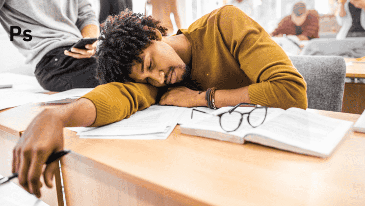 A student studying and sleeping