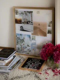 a bunch of books and a vase of flowers on a table