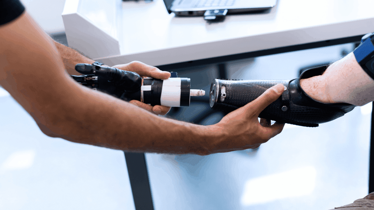 A person fixing a prosthetic arm, showing the qualities of a good friend