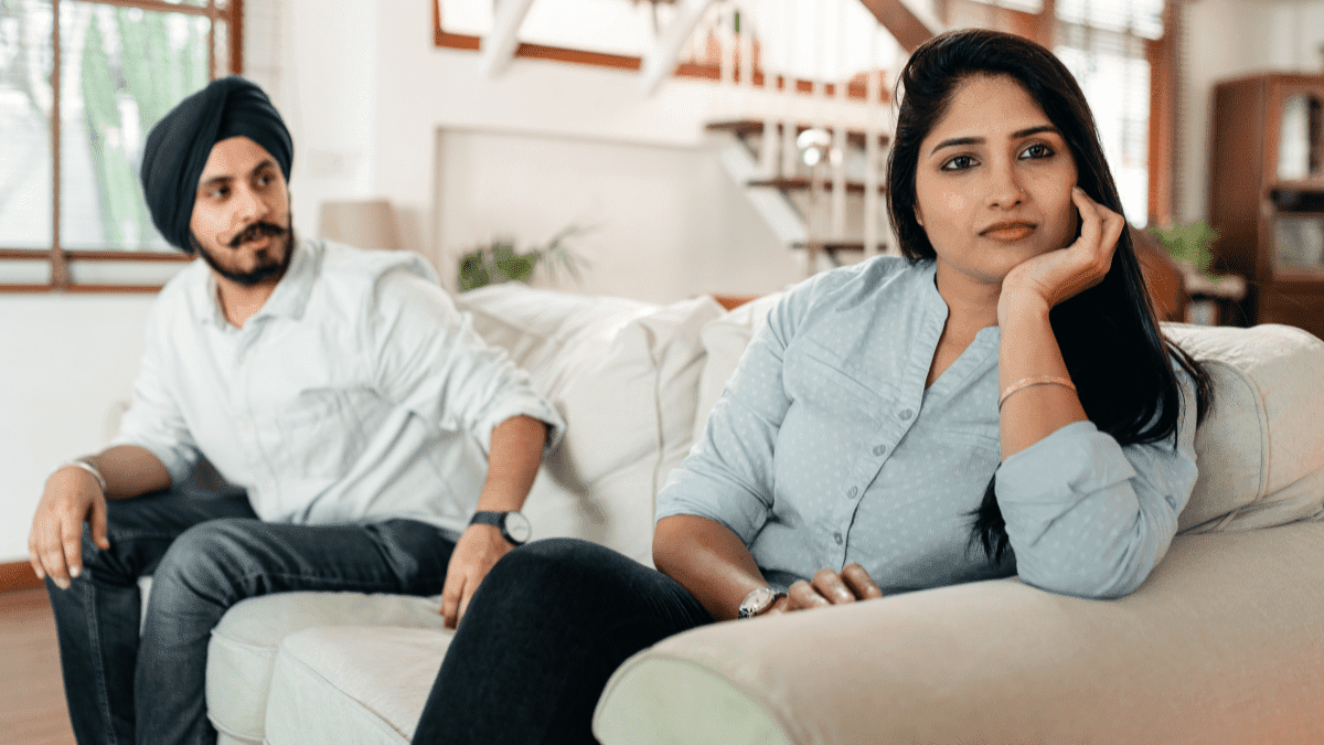 A woman completely lost in her thoughts while discussing with her partner