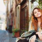 A woman sitting on a chair | 20 Good habits to start in your 20s