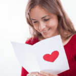 A girl reading love messages and smiling