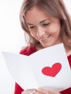 A girl reading love messages and smiling