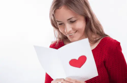A girl reading love messages and smiling