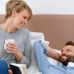 Couple talking dirty on bed