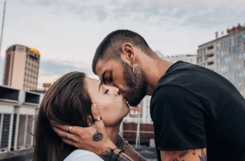 A guy kissing a girl